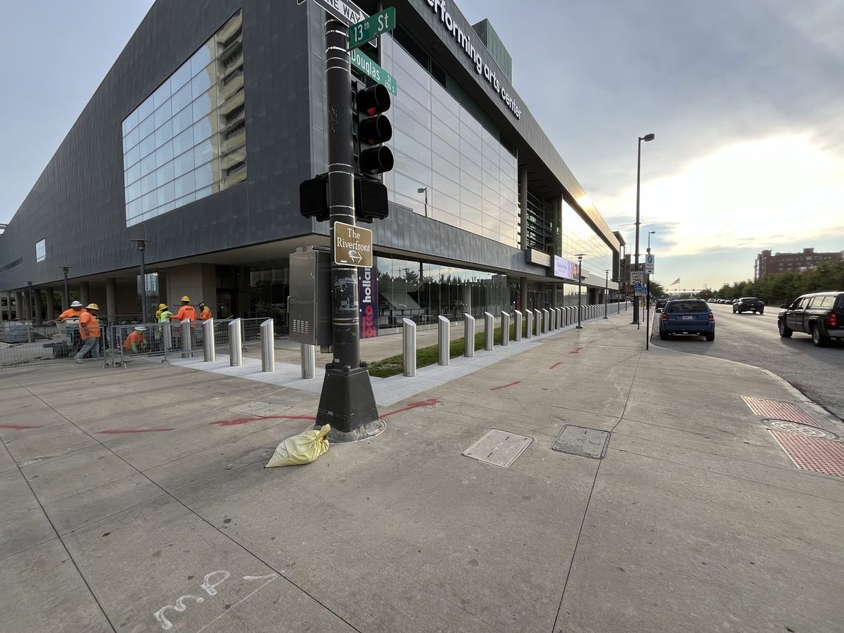 Brushed stainless steel security bollards protecting the perimeter of the Omaha Performing Arts center
