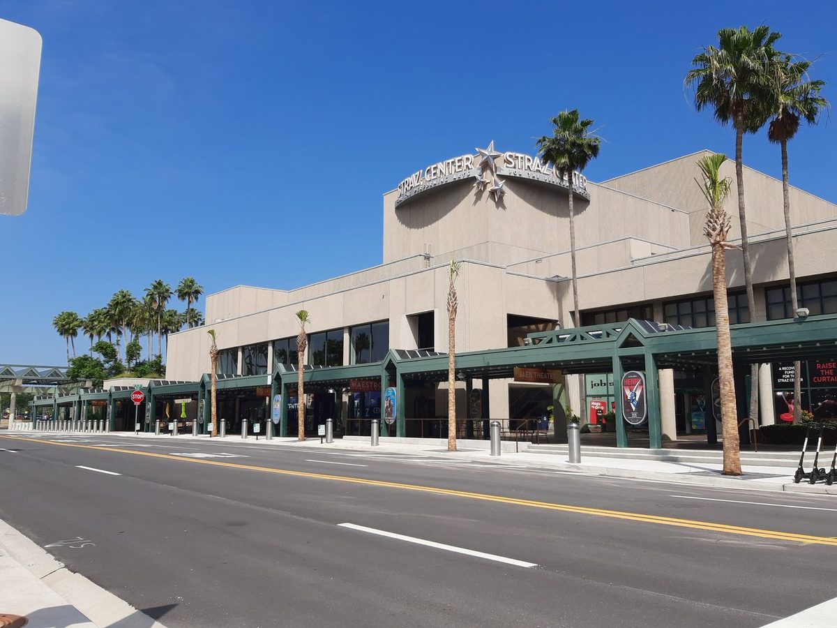 Stainless steel security bollards lining the entrance plaza of the Straz Center in Tampa, Florida